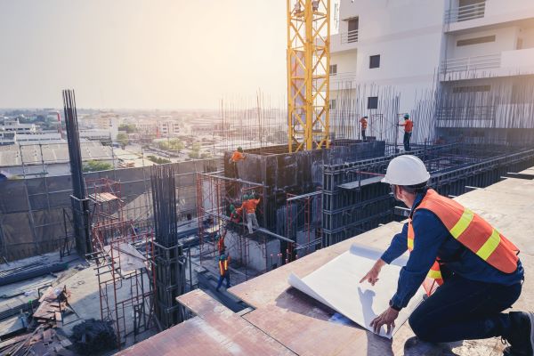 Photo of contractor working on roof of building